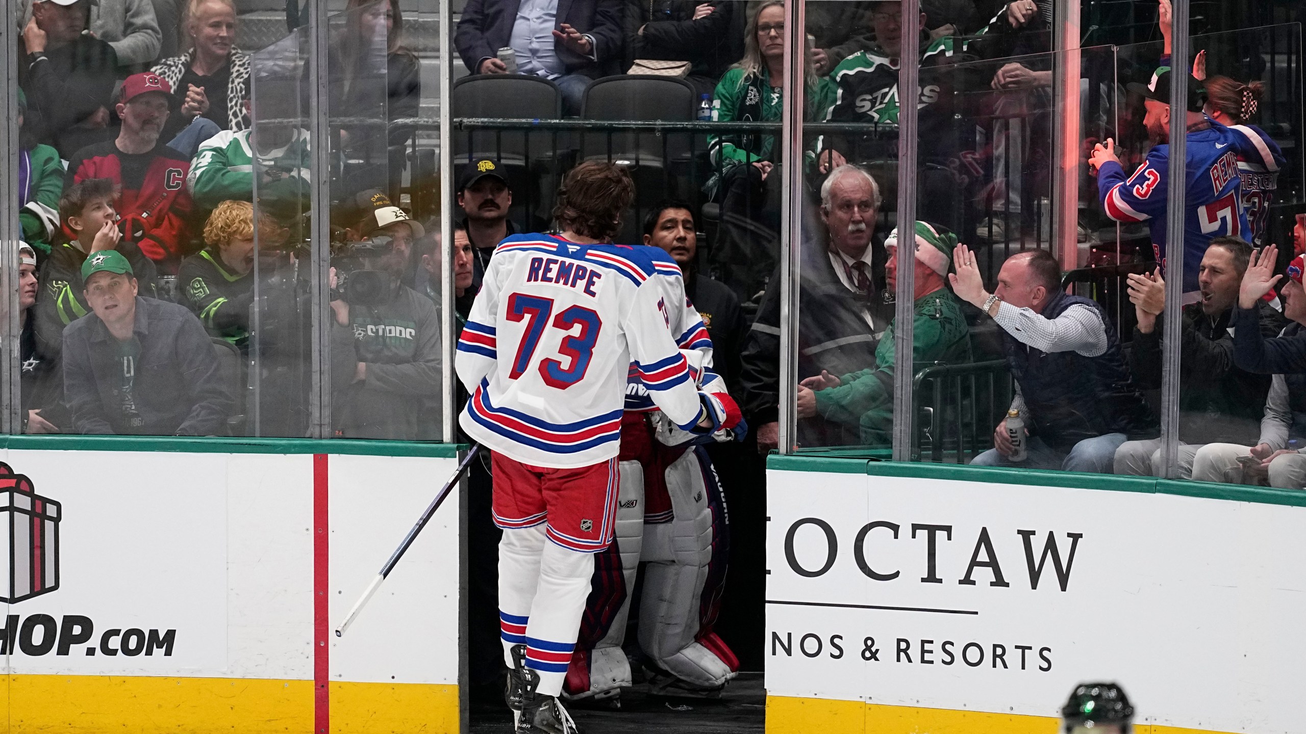 New York Rangers center Matt Rempe (73) leaves the game after being ejected for game misconduct in the third period of an NHL hockey game against the Dallas Stars in Dallas, Friday, Dec. 20, 2024. (AP Photo/Tony Gutierrez)