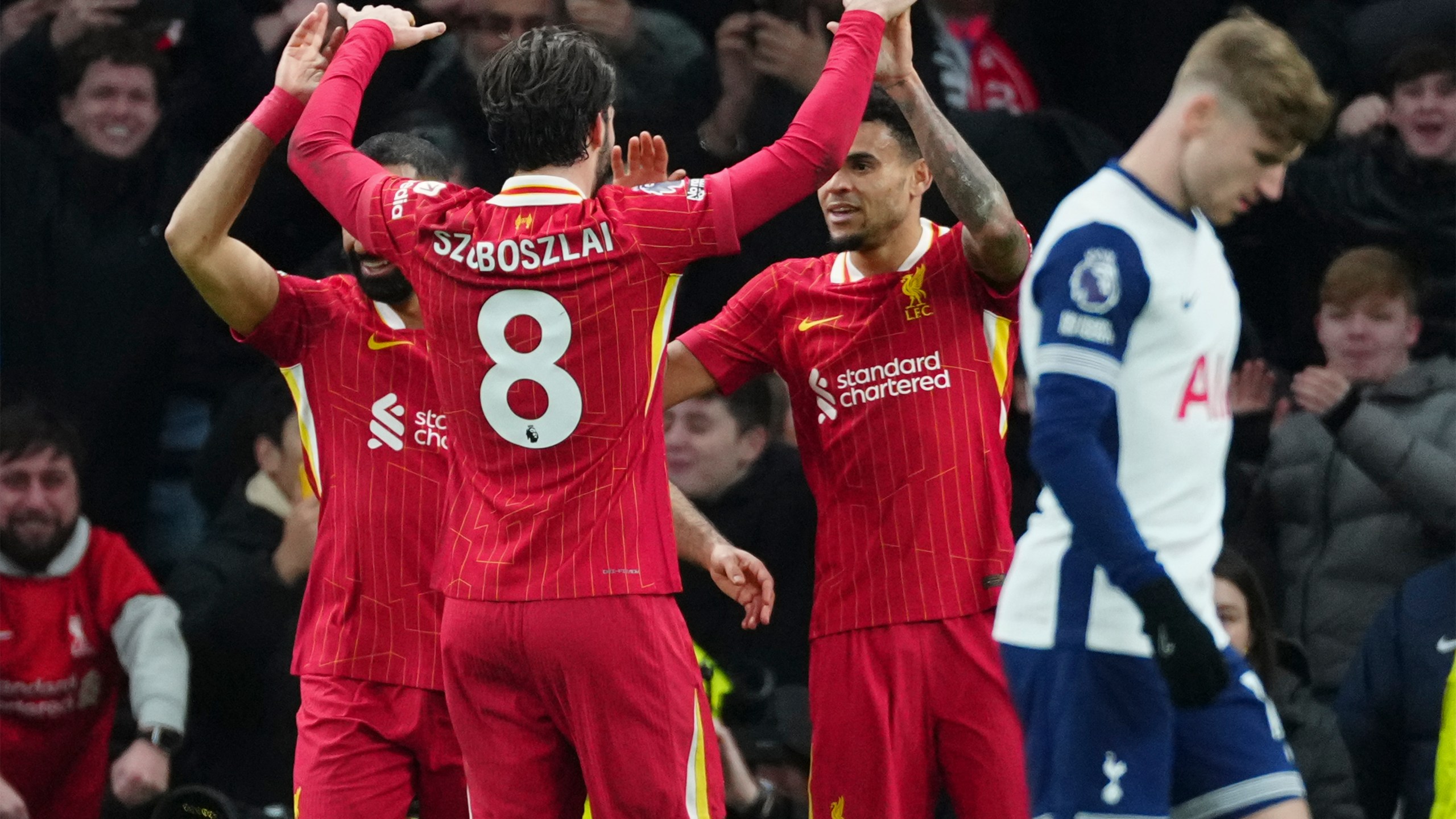 Liverpool's Luis Diaz, second right, celebrates with teammates after scoring his side's sixth goal during the English Premier League soccer match between Tottenham and Liverpool at Tottenham Hotspur Stadium in London, Sunday, Dec. 22, 2024. (AP Photo/Dave Shopland)