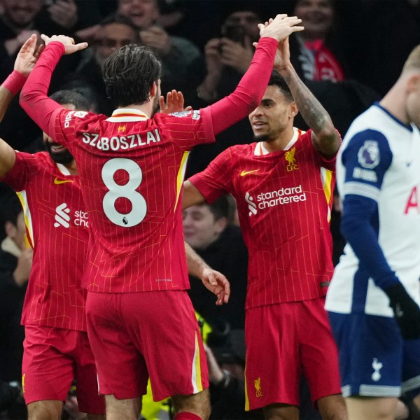 Liverpool's Luis Diaz, second right, celebrates with teammates after scoring his side's sixth goal during the English Premier League soccer match between Tottenham and Liverpool at Tottenham Hotspur Stadium in London, Sunday, Dec. 22, 2024. (AP Photo/Dave Shopland)