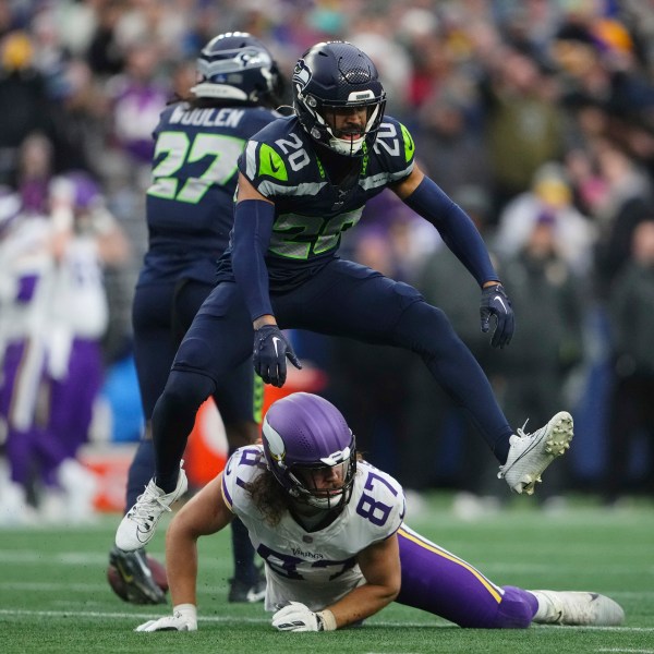 Seattle Seahawks safety Julian Love (20) celebrates after forcing a incomplete pass intended for Minnesota Vikings tight end T.J. Hockenson (87) during the second half of an NFL football game, Sunday, Dec. 22, 2024, in Seattle. (AP Photo/Lindsey Wasson)