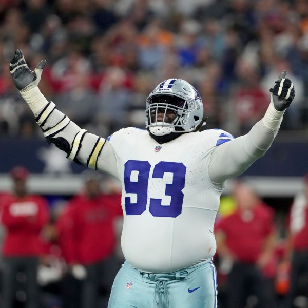 Dallas Cowboys defensive tackle Linval Joseph celebrates a sack of Tampa Bay Buccaneers quarterback Baker Mayfield in the second half of an NFL football game in Arlington, Texas, Sunday, Dec. 22, 2024. (AP Photo/Jeffrey McWhorter)