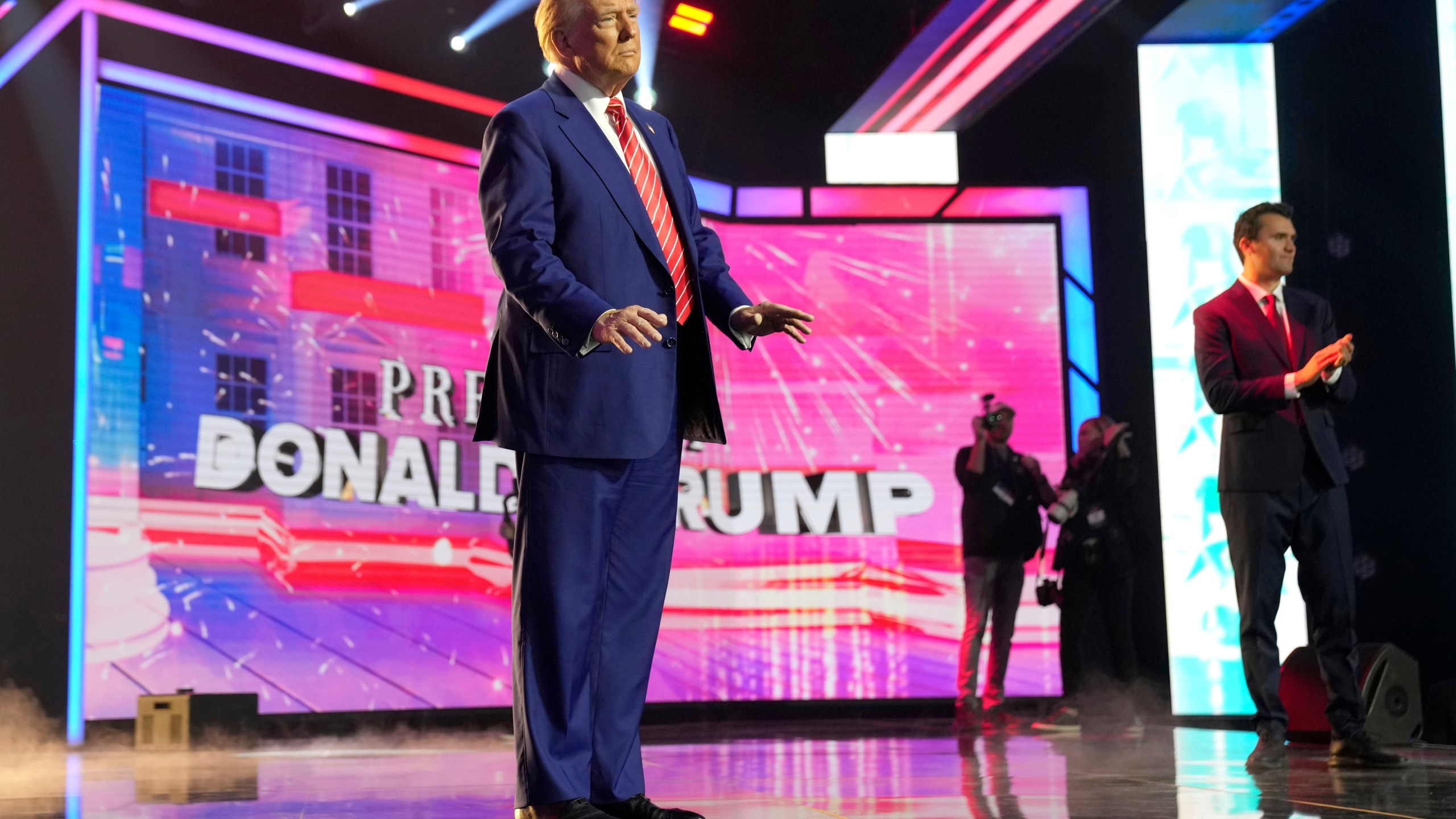 President-elect Donald Trump arrives to speak at AmericaFest, Sunday, Dec. 22, 2024, in Phoenix. (AP Photo/Rick Scuteri)