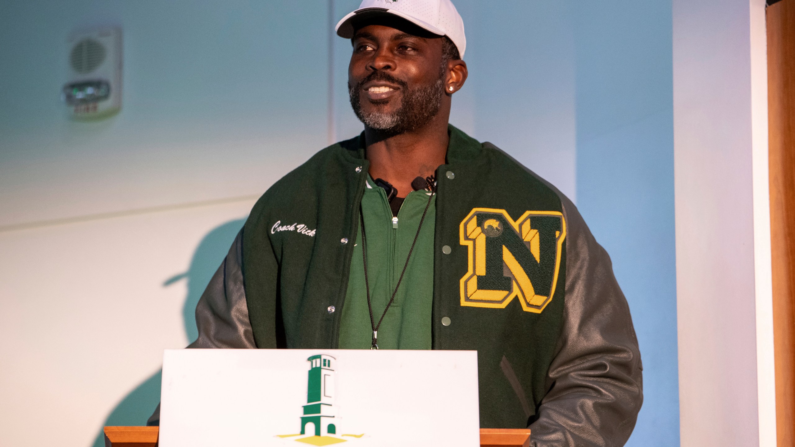 Michael Vick speaks to media and attendees after he is introduced as the head coach of the Norfolk State football team during a press conference on Monday, Dec. 23, 2024 in Norfolk, Va. (AP Photo/Mike Caudill)