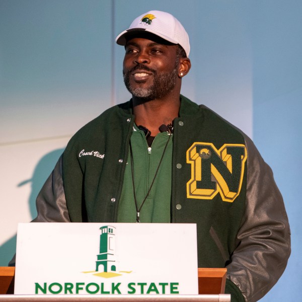 Michael Vick speaks to media and attendees after he is introduced as the head coach of the Norfolk State football team during a press conference on Monday, Dec. 23, 2024 in Norfolk, Va. (AP Photo/Mike Caudill)