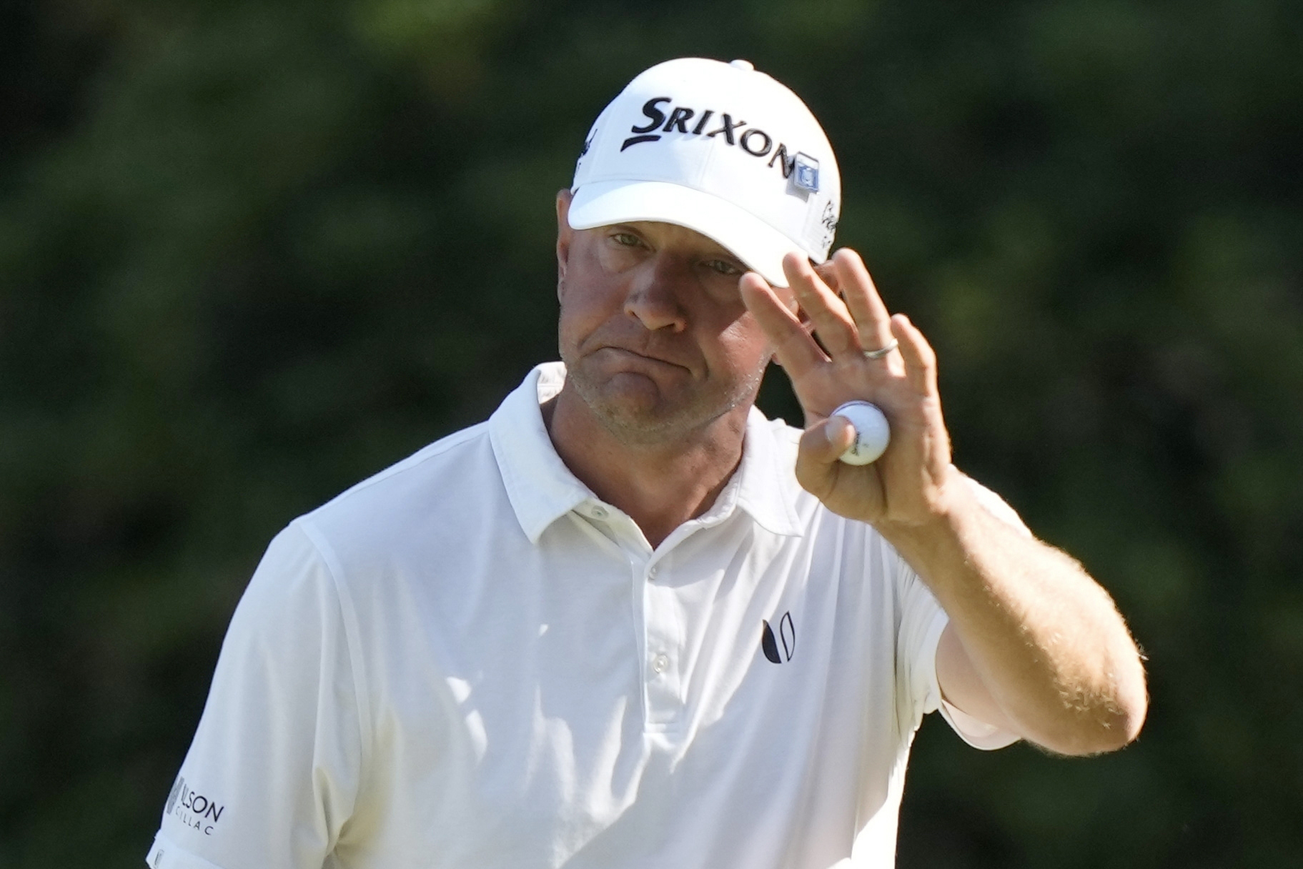 FILE - Lucas Glover waves after making a putt on the 13th hole during third round at the Masters golf tournament at Augusta National Golf Club Saturday, April 13, 2024, in Augusta, Ga. (AP Photo/Charlie Riedel, File)