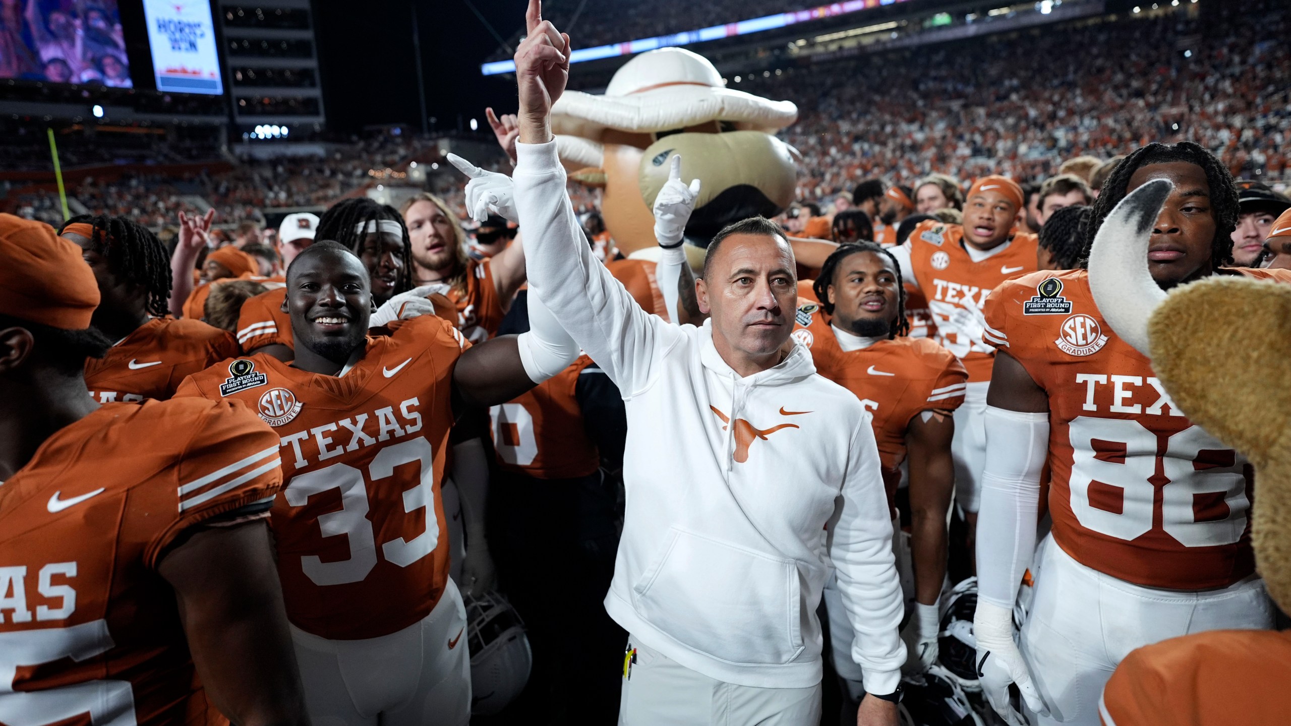 Texas head coach Steve Sarkisian celebrates with his team after a first round game against Clemson in the College Football Playoff, Saturday, Dec. 21, 2024, in Austin, Texas. (AP Photo/Eric Gay)