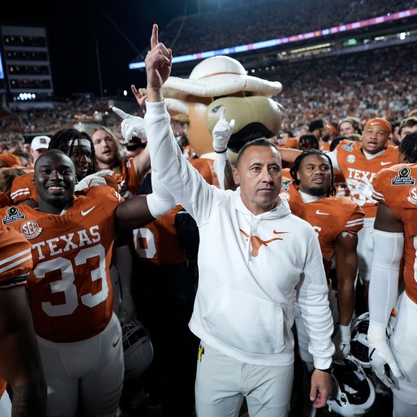 Texas head coach Steve Sarkisian celebrates with his team after a first round game against Clemson in the College Football Playoff, Saturday, Dec. 21, 2024, in Austin, Texas. (AP Photo/Eric Gay)