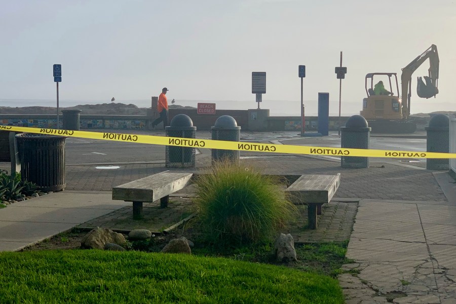 Caution tape closes Capitola Beach due to high surf on Monday, Dec. 23, 2024, in Capitola, Calif. (AP Photo/Pamela Hassell)