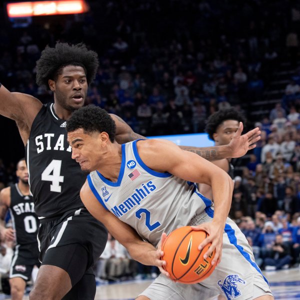 Mississippi State forward Cameron Matthews (4) defends Memphis forward Nicholas Jourdain (2) during the first half of an NCAA college basketball game Saturday, Dec. 21, 2024, in Memphis, Tenn. (AP Photo/Nikki Boertman)