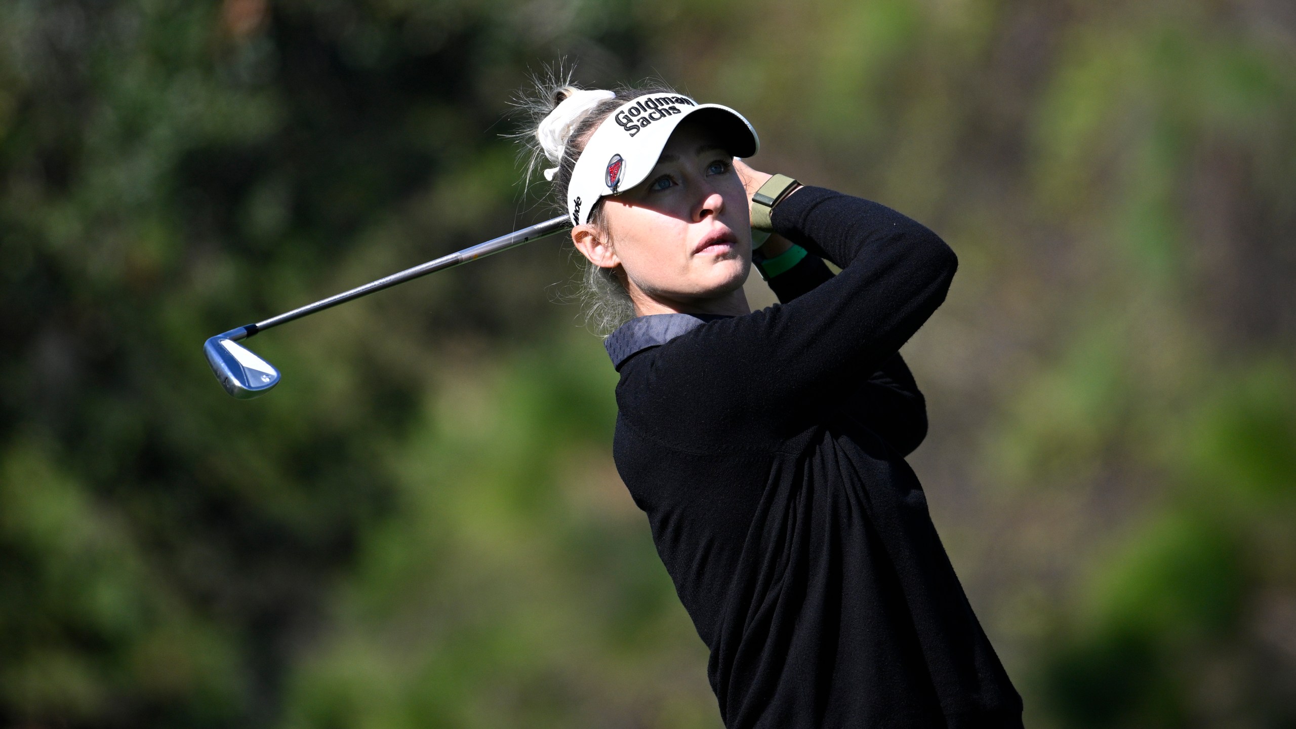 Nelly Korda watches her tee shot on the fourth hole during the first round of the PNC Championship golf tournament, Saturday, Dec. 21, 2024 in Orlando. (AP Photo/Phelan M. Ebenhack)