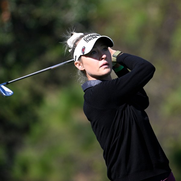 Nelly Korda watches her tee shot on the fourth hole during the first round of the PNC Championship golf tournament, Saturday, Dec. 21, 2024 in Orlando. (AP Photo/Phelan M. Ebenhack)