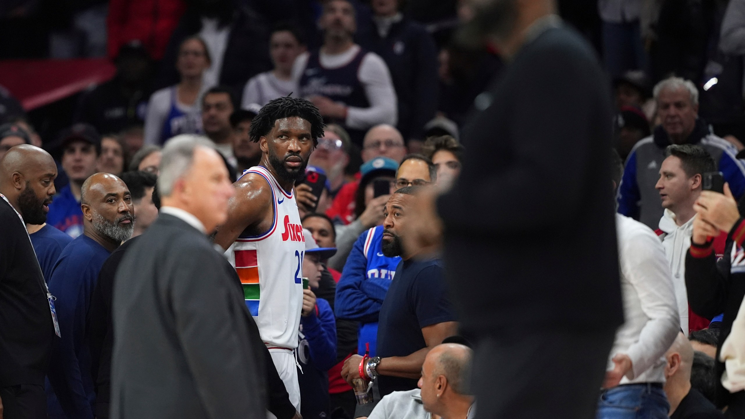 Philadelphia 76ers' Joel Embiid glares after being ejected by official Jenna Schroeder during the first half of an NBA basketball game against the San Antonio Spurs, Monday, Dec. 23, 2024, in Philadelphia. (AP Photo/Matt Slocum)