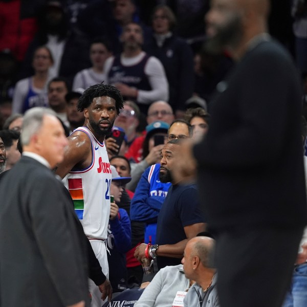 Philadelphia 76ers' Joel Embiid glares after being ejected by official Jenna Schroeder during the first half of an NBA basketball game against the San Antonio Spurs, Monday, Dec. 23, 2024, in Philadelphia. (AP Photo/Matt Slocum)