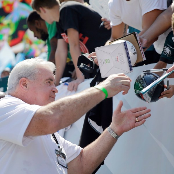 FILE - Former Philadelphia Eagles player Bill Bergey signs autographs for fans at the Eagles' NFL football training camp, Tuesday, Aug. 4, 2015, in Philadelphia. (AP Photo/Matt Rourke, File)