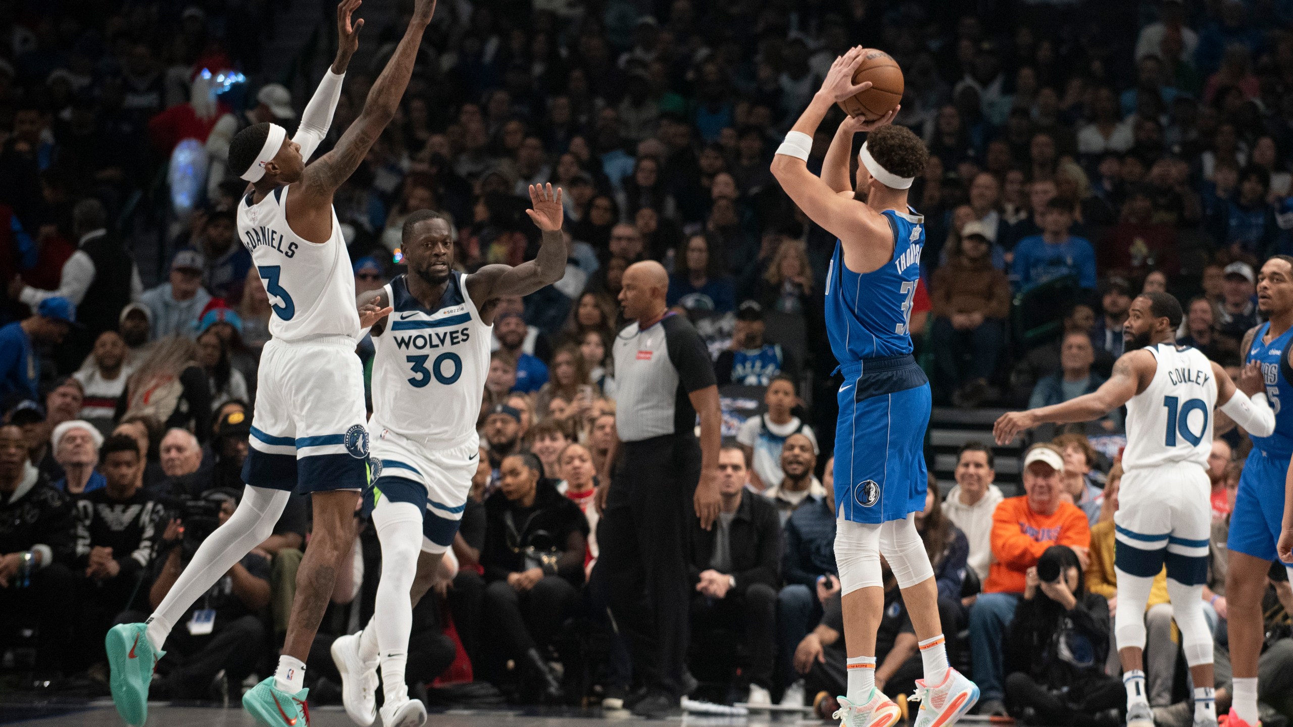 Dallas Mavericks guard Klay Thompson (31) attempts a three-pointer in the first half of an NBA basketball game on Wednesday, Dec. 25, 2024, in Dallas. (AP Photo/Emil T. Lippe)