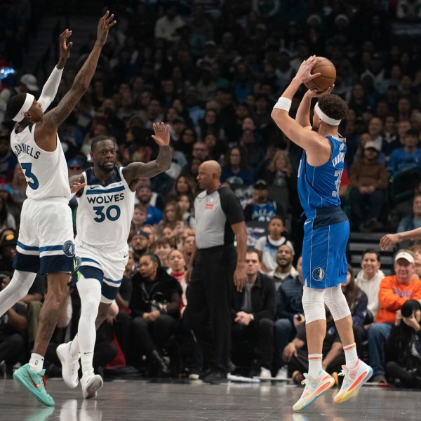 Dallas Mavericks guard Klay Thompson (31) attempts a three-pointer in the first half of an NBA basketball game on Wednesday, Dec. 25, 2024, in Dallas. (AP Photo/Emil T. Lippe)