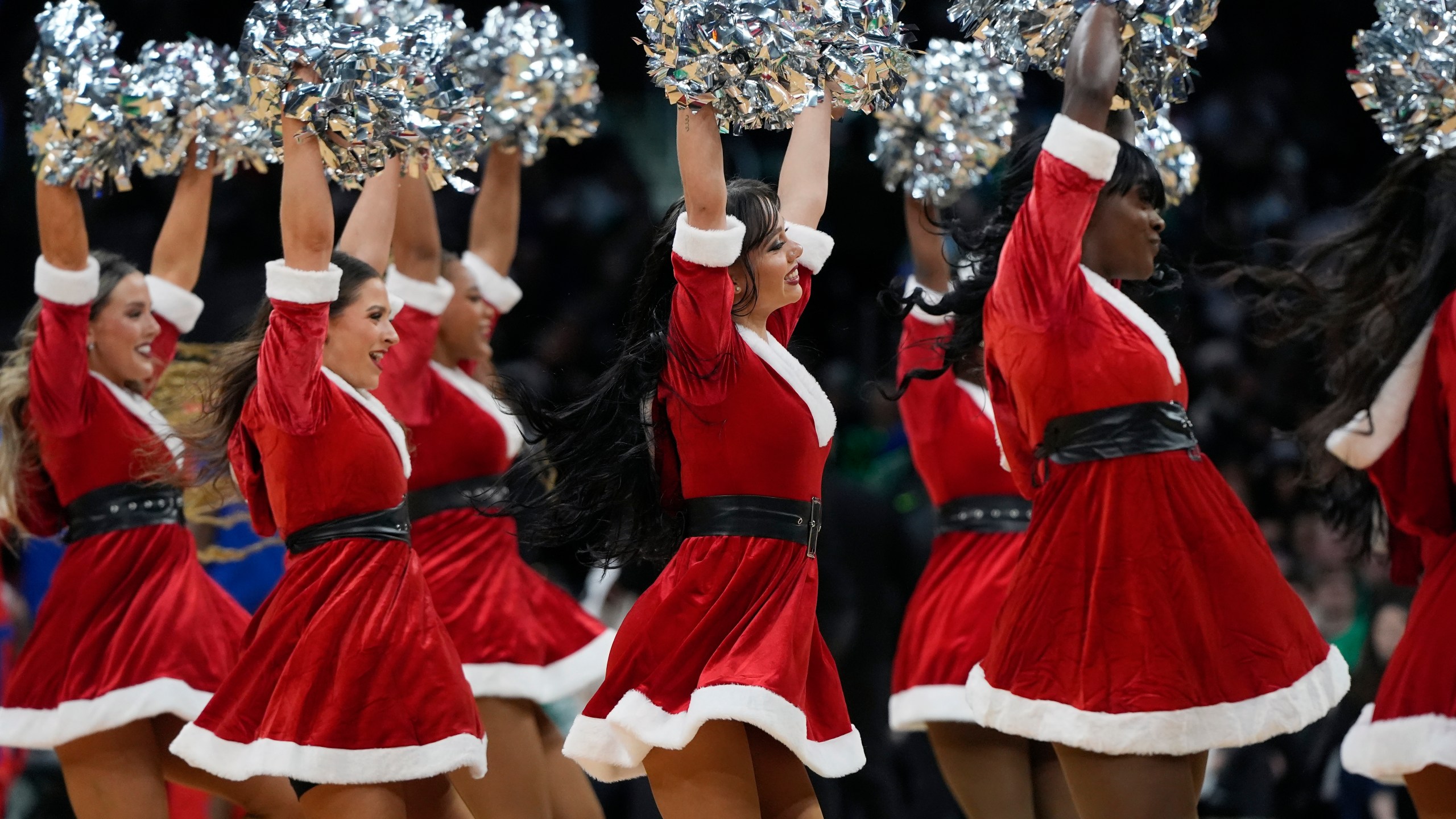 The Boston Celtics cheerleaders perform during the first half of an NBA basketball game between the Boston Celtics and the Philadelphia 76ers, Wednesday, Dec. 25, 2024, in Boston (AP Photo/Michael Dwyer)