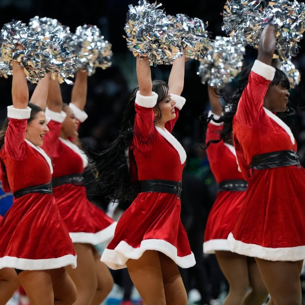 The Boston Celtics cheerleaders perform during the first half of an NBA basketball game between the Boston Celtics and the Philadelphia 76ers, Wednesday, Dec. 25, 2024, in Boston (AP Photo/Michael Dwyer)