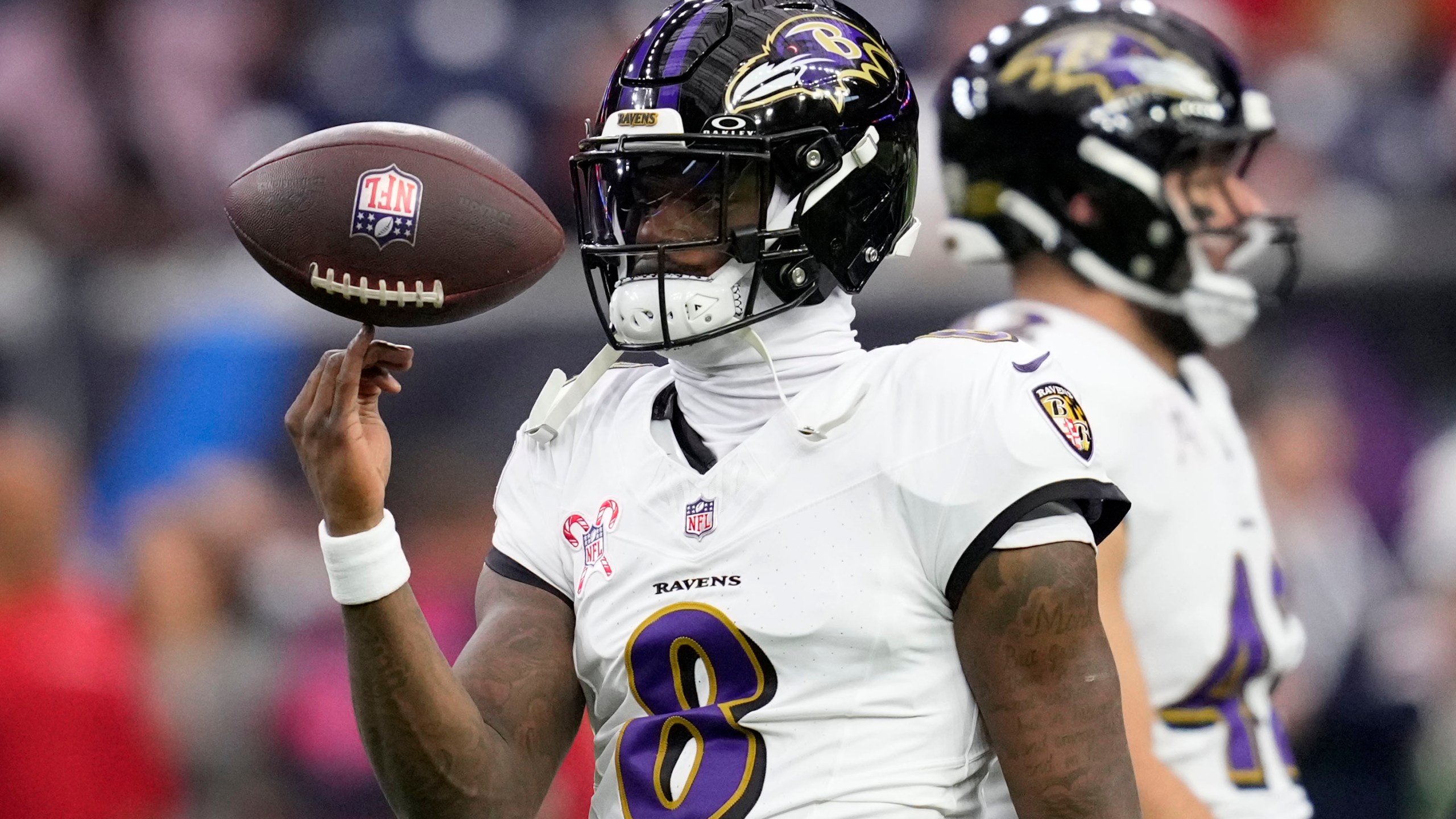 Baltimore Ravens quarterback Lamar Jackson warms up before an NFL football game against the Houston Texans, Wednesday, Dec. 25, 2024, in Houston. (AP Photo/David J. Phillip)