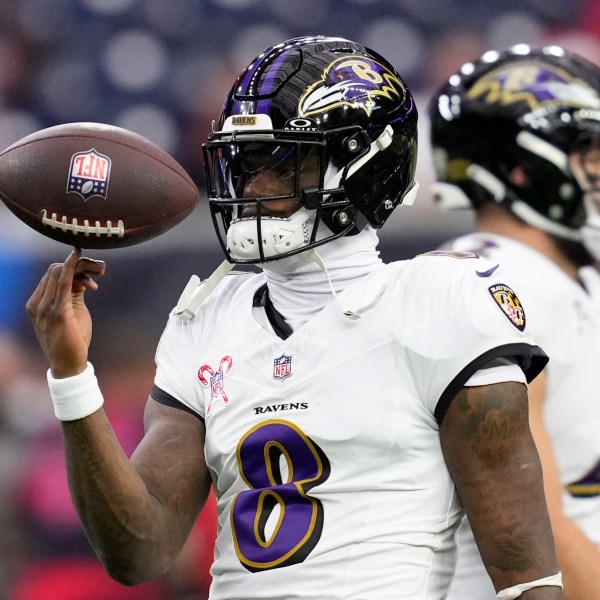 Baltimore Ravens quarterback Lamar Jackson warms up before an NFL football game against the Houston Texans, Wednesday, Dec. 25, 2024, in Houston. (AP Photo/David J. Phillip)