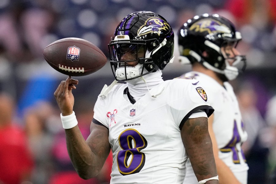 Baltimore Ravens quarterback Lamar Jackson warms up before an NFL football game against the Houston Texans, Wednesday, Dec. 25, 2024, in Houston. (AP Photo/David J. Phillip)