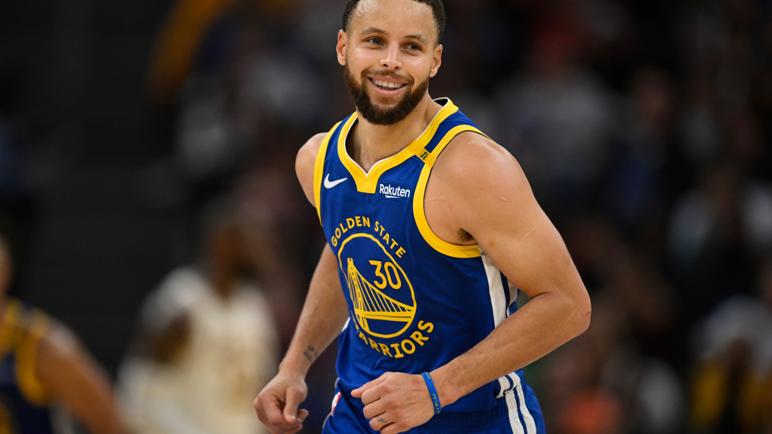 Golden State Warriors guard Stephen Curry (30) celebrates a three-point basket during the first half of an NBA basketball game against the Los Angeles Lakers, Wednesday, Dec. 25, 2024, in San Francisco. (AP Photo/Eakin Howard)