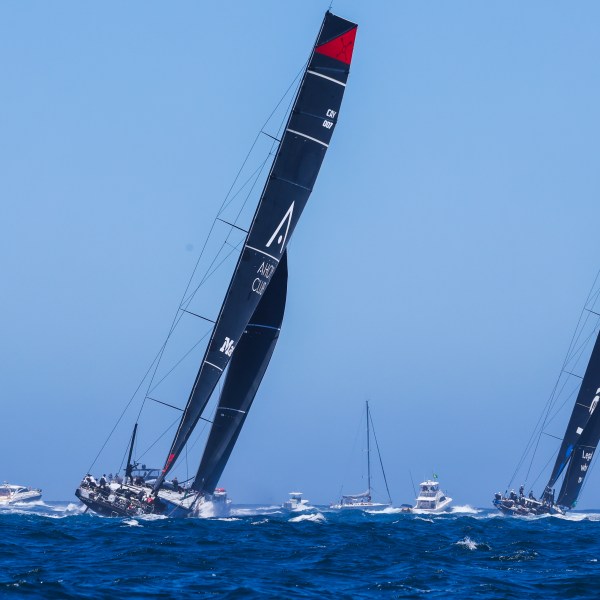 Master Lock Comanche, left, and LawConnect sail out of the heads following the start of the Sydney to Hobart yacht race in Sydney, Thursday, Dec. 26, 2024. (Mark Evans/AAP Image via AP).