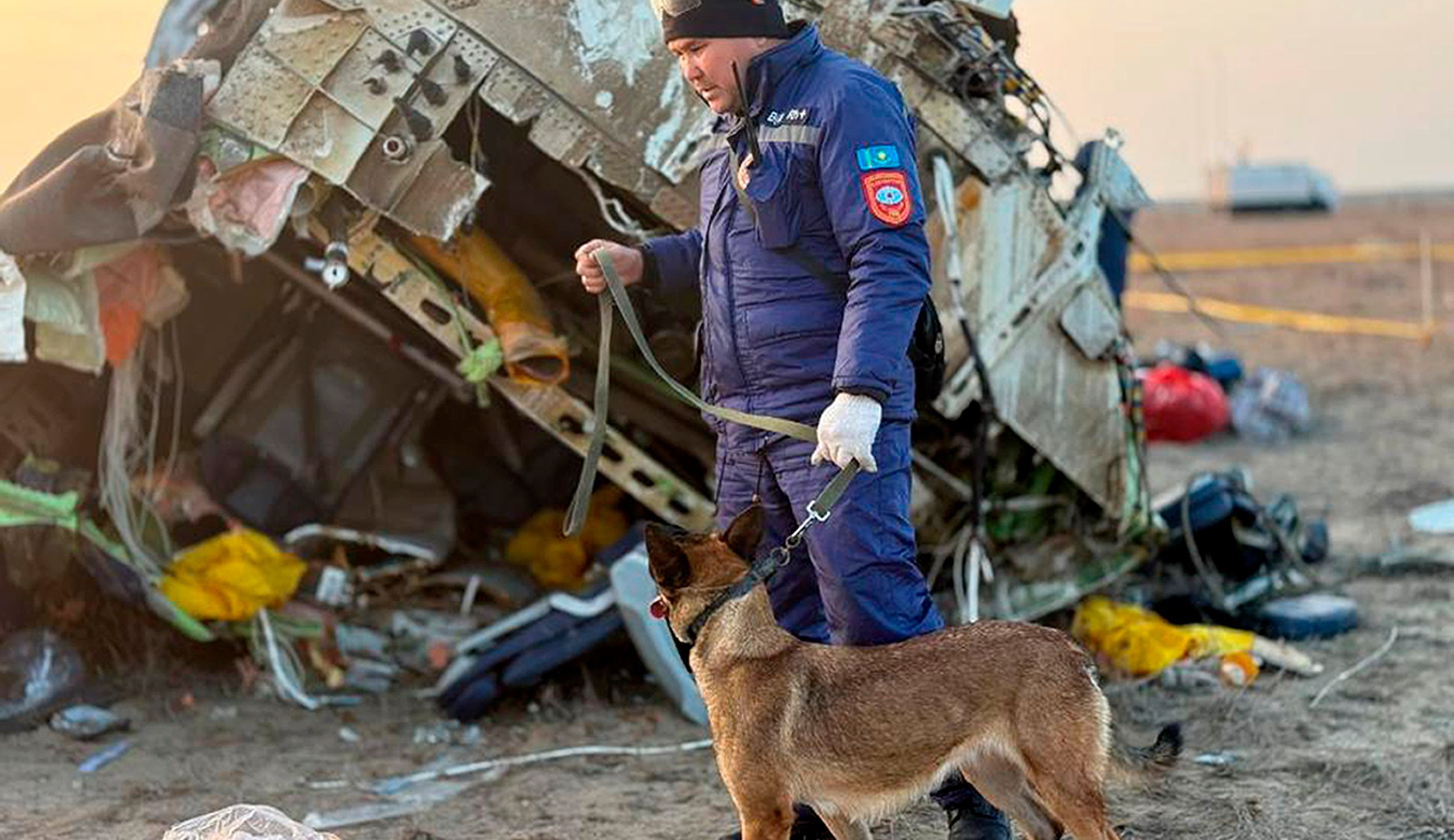 In this photo released by Kazakhstan's Emergency Ministry Press Service, rescuers work at the wreckage of Azerbaijan Airlines Embraer 190 lays on the ground near the airport of Aktau, Kazakhstan, Thursday, Dec. 26, 2024. (Kazakhstan's Emergency Ministry Press Service via AP)