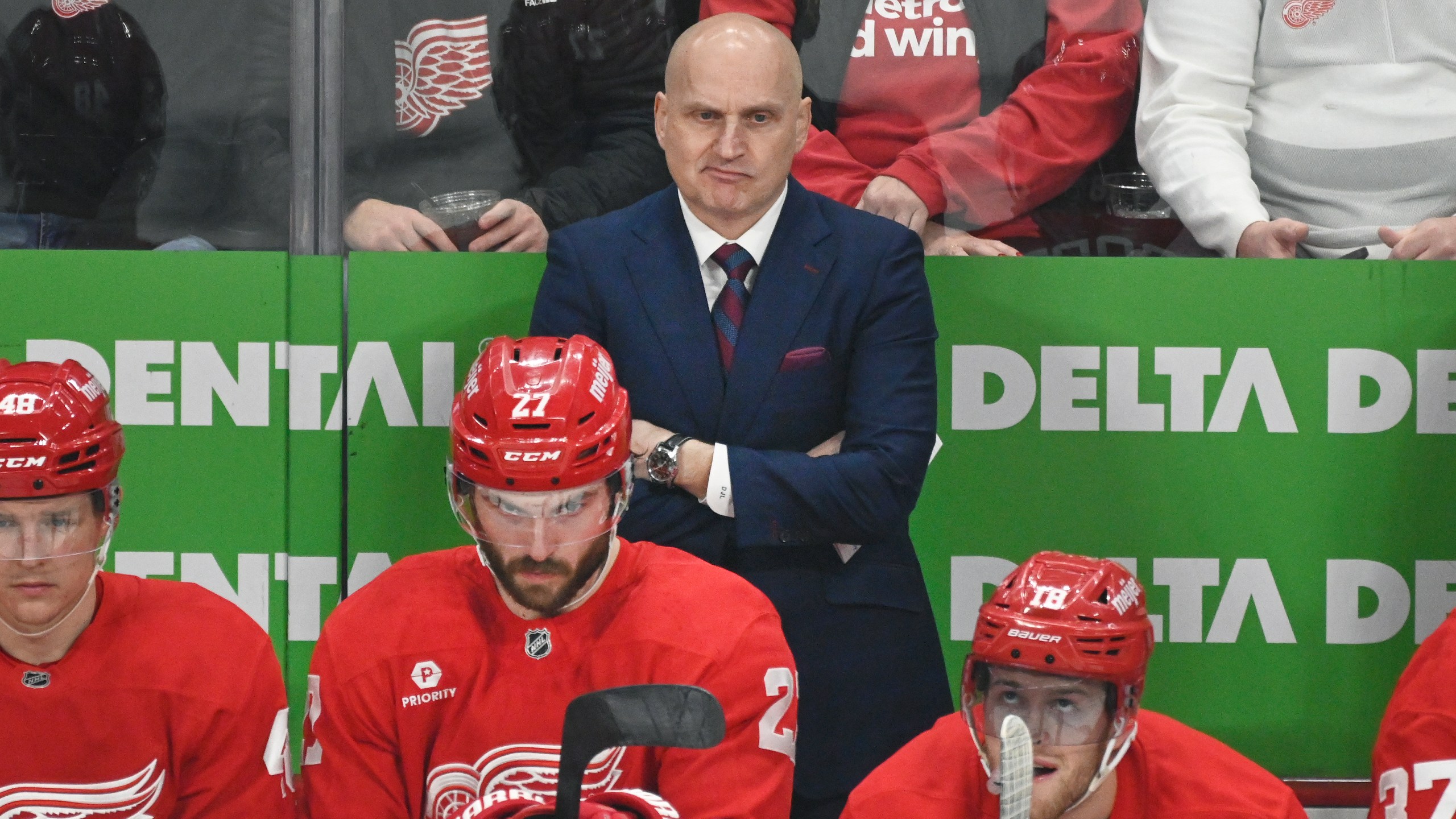 Detroit Red Wings head coach Derek Lalonde, standing, watches during the first period of an NHL hockey game against the St. Louis Blues, Monday, Dec. 23, 2024, in Detroit. (AP Photo/Jose Juarez)