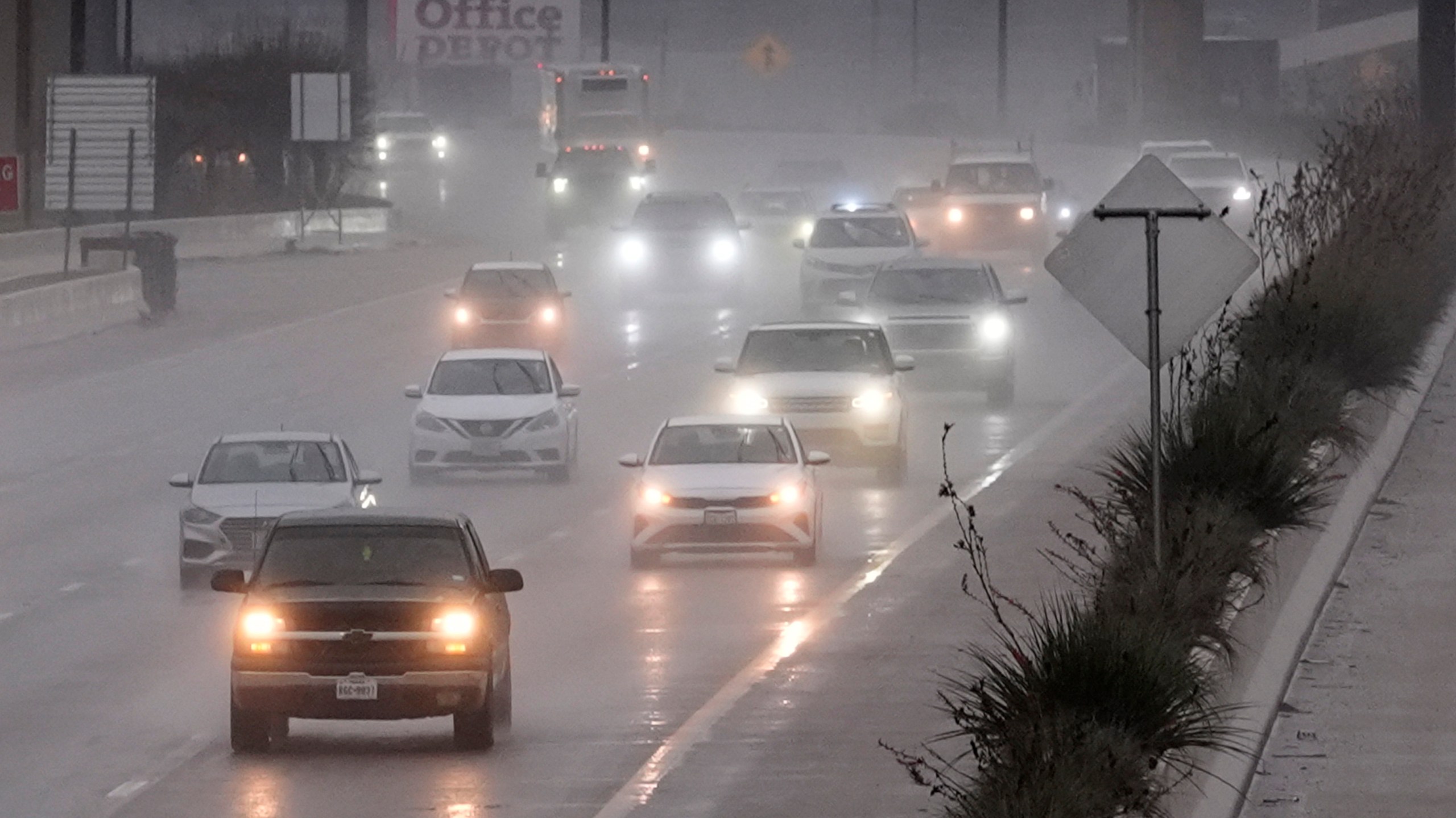 Vehicles make their way on a rain soaked highway in Dallas, Thursday, Dec. 26, 2024. (AP Photo/LM Otero)