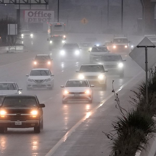 Vehicles make their way on a rain soaked highway in Dallas, Thursday, Dec. 26, 2024. (AP Photo/LM Otero)