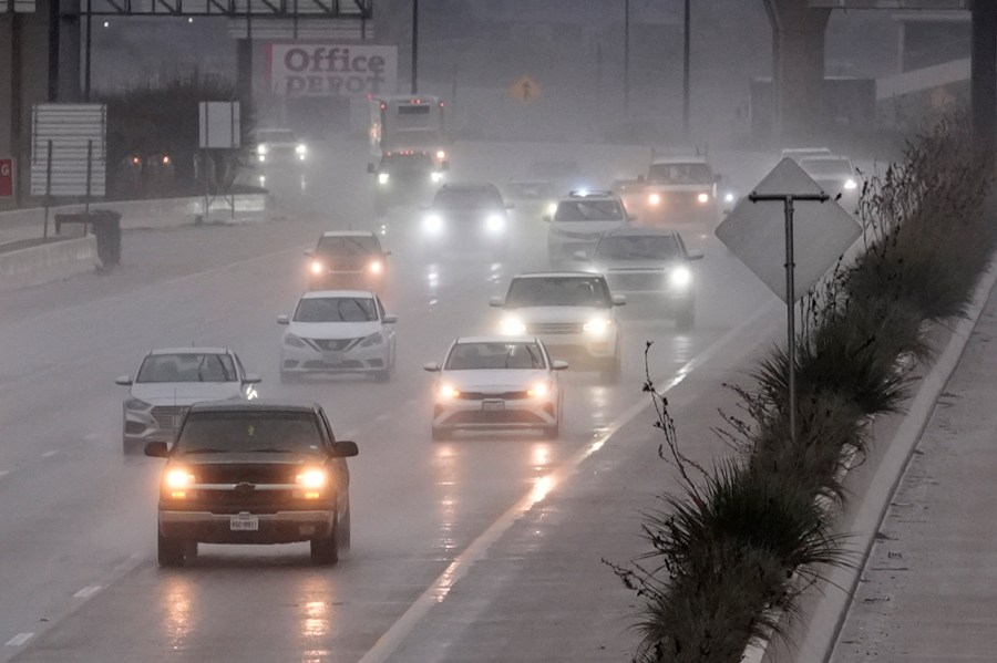 Vehicles make their way on a rain soaked highway in Dallas, Thursday, Dec. 26, 2024. (AP Photo/LM Otero)