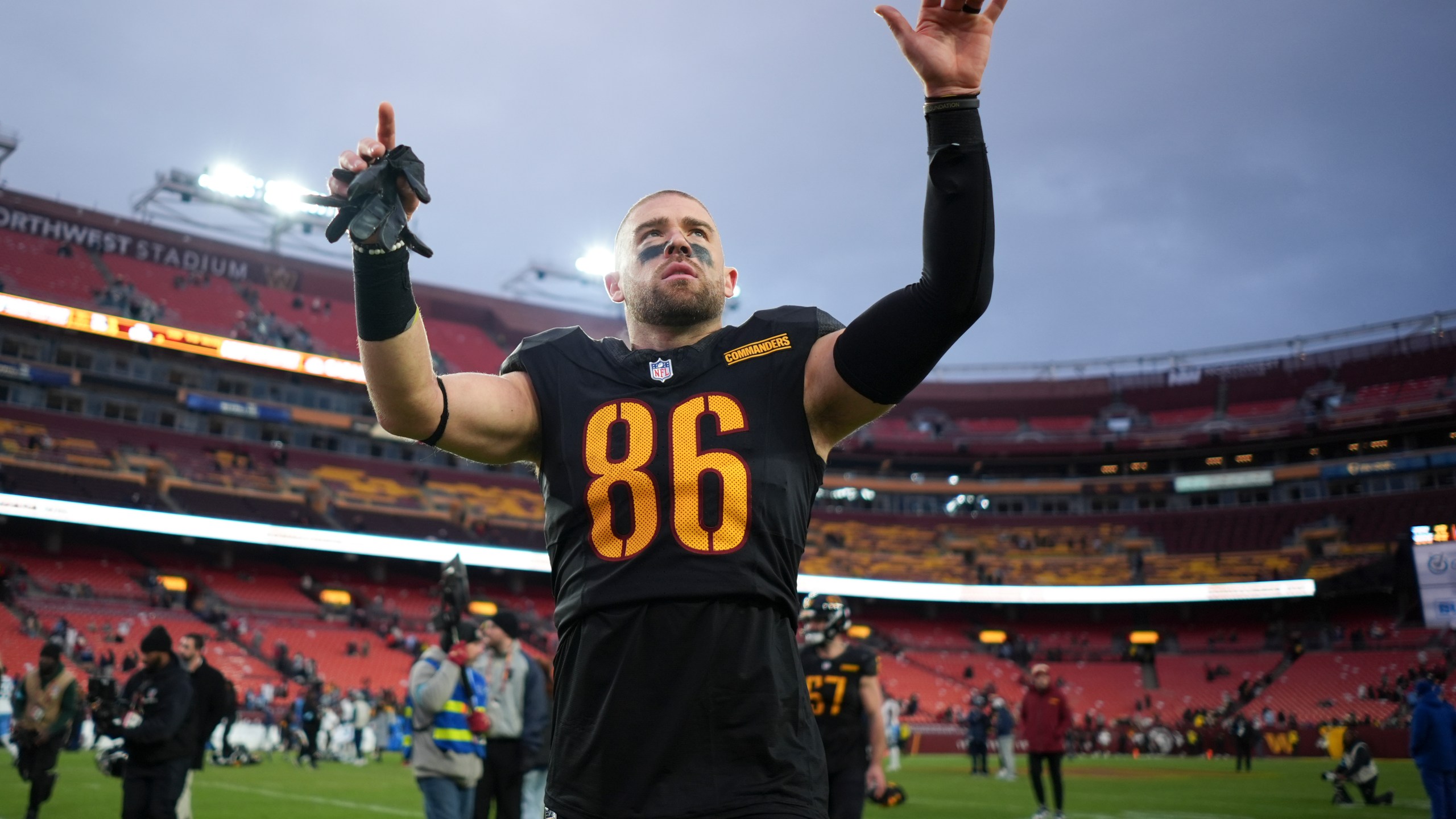 Washington Commanders tight end Zach Ertz (86) celebrates the team's 42-19 win against the Tennessee Titans in an NFL football game Sunday, Dec. 1, 2024, in Landover, Md. (AP Photo/Matt Slocum)