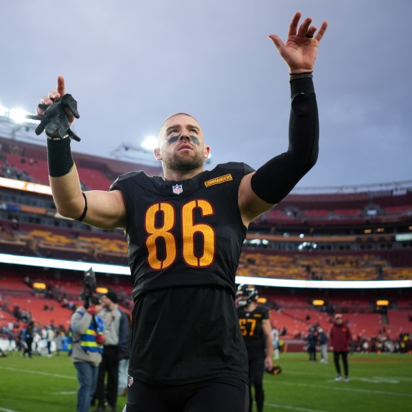 Washington Commanders tight end Zach Ertz (86) celebrates the team's 42-19 win against the Tennessee Titans in an NFL football game Sunday, Dec. 1, 2024, in Landover, Md. (AP Photo/Matt Slocum)