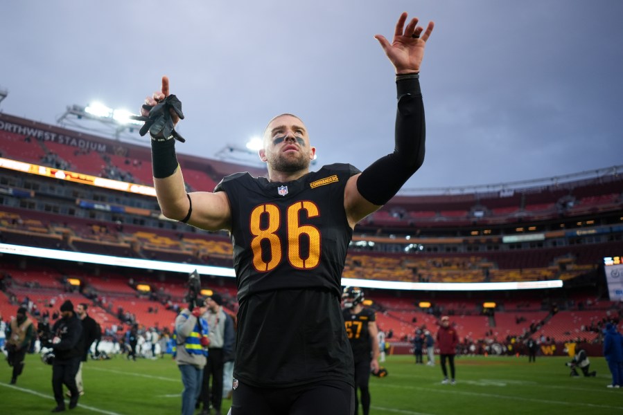 Washington Commanders tight end Zach Ertz (86) celebrates the team's 42-19 win against the Tennessee Titans in an NFL football game Sunday, Dec. 1, 2024, in Landover, Md. (AP Photo/Matt Slocum)