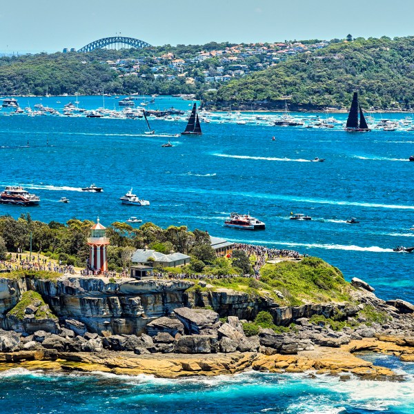 In this photo provided by Rolex, competitors sail towards the heads as they leave Sydney Harbour at the start of the Sydney to Hobart yacht race in Sydney, Thursday, Dec. 26, 2024. (Carlo Borlenghi/Rolex via AP)