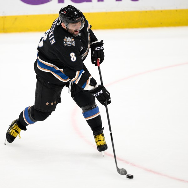 FILE - Washington Capitals left wing Alex Ovechkin (8) shoots the puck during the third period of an NHL hockey game against the Nashville Predators, Nov. 6, 2024, in Washington. (AP Photo/Nick Wass, File)