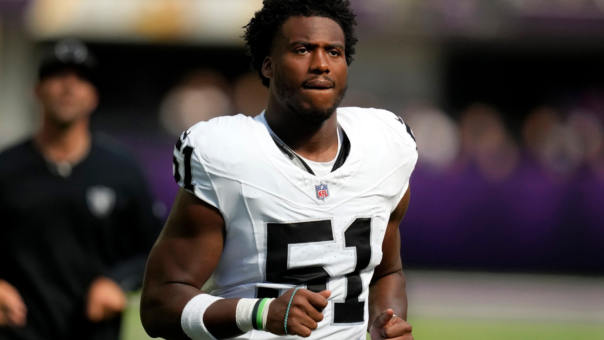 FILE - Las Vegas Raiders defensive end Malcolm Koonce (51) runs off the field at halftime of an NFL preseason football game against the Minnesota Vikings, Aug. 10, 2024, in Minneapolis. (AP Photo/Charlie Neibergall, File)