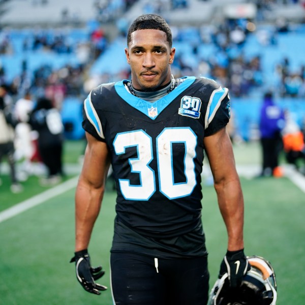 Carolina Panthers running back Chuba Hubbard leaves the field after scoring the winning touchdown against the Arizona Cardinals during overtime of an NFL football game, Sunday, Dec. 22, 2024, in Charlotte, N.C. (AP Photo/Jacob Kupferman)