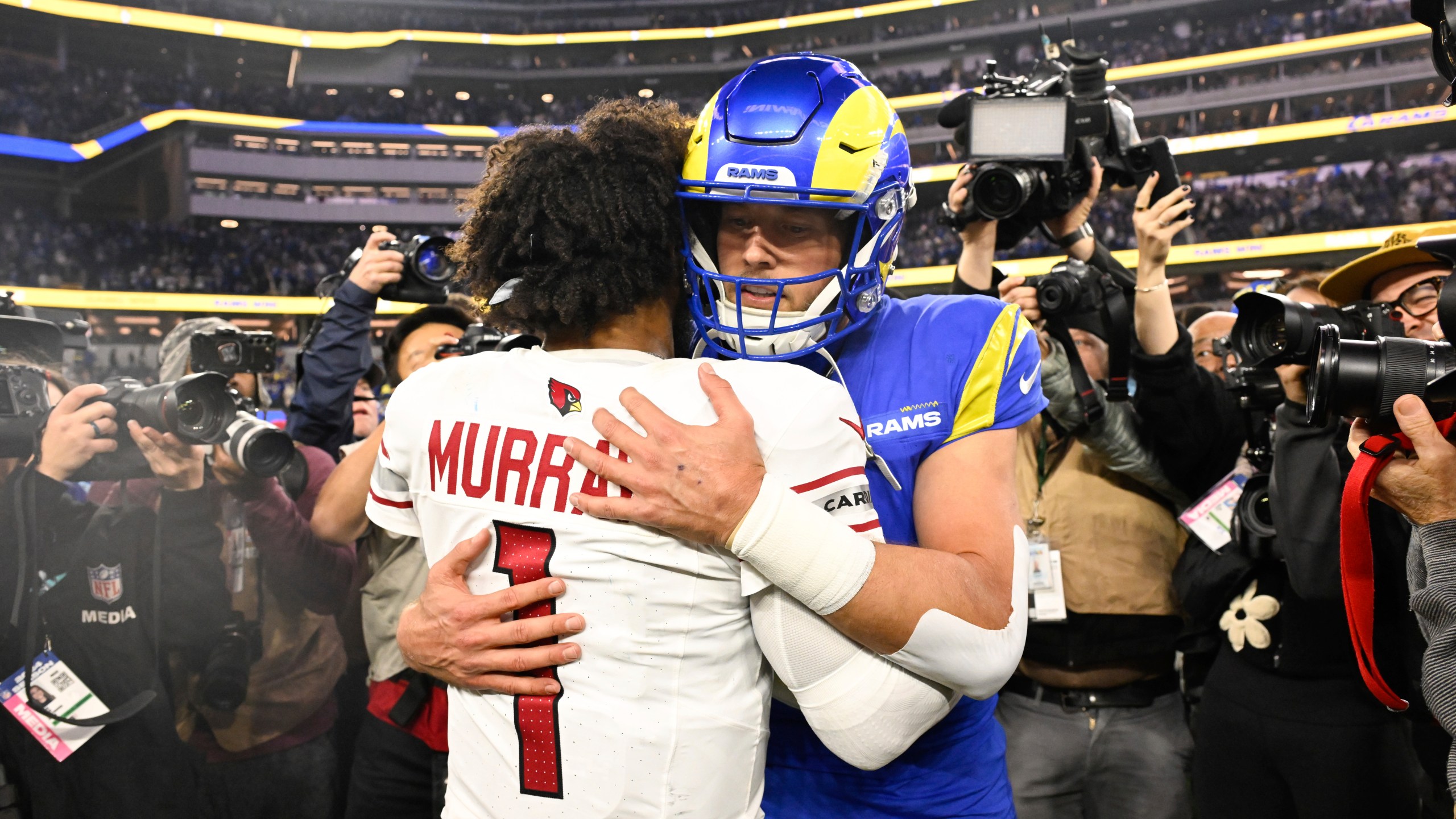 Arizona Cardinals quarterback Kyler Murray (1) hugs Los Angeles Rams quarterback Matthew Stafford after an NFL football game Saturday, Dec. 28, 2024, in Inglewood, Calif. (AP Photo/Alex Gallardo)