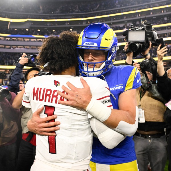 Arizona Cardinals quarterback Kyler Murray (1) hugs Los Angeles Rams quarterback Matthew Stafford after an NFL football game Saturday, Dec. 28, 2024, in Inglewood, Calif. (AP Photo/Alex Gallardo)