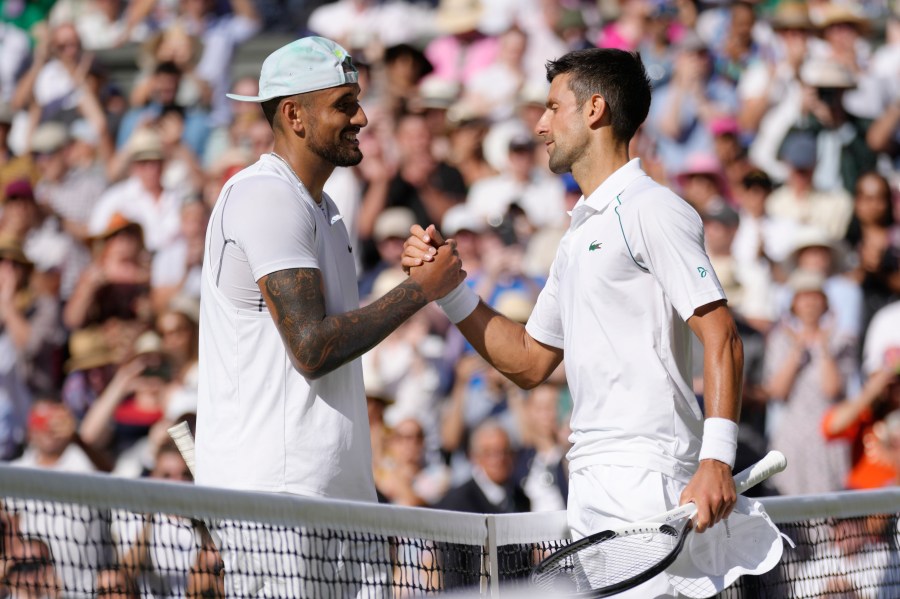 FILE - Serbia's Novak Djokovic, right, celebrates beating Australia's Nick Kyrgios in the final of the men's singles on day fourteen of the Wimbledon tennis championships in London, Sunday, July 10, 2022. (AP Photo/Kirsty Wigglesworth, File)