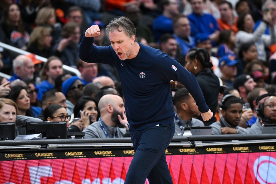 Washington Wizards head coach Brian Keefe reacts to a foul called against his team during the first half of an NBA basketball game against the New York Knicks, Saturday, Dec. 28, 2024, in Washington. (AP Photo/Terrance Williams)