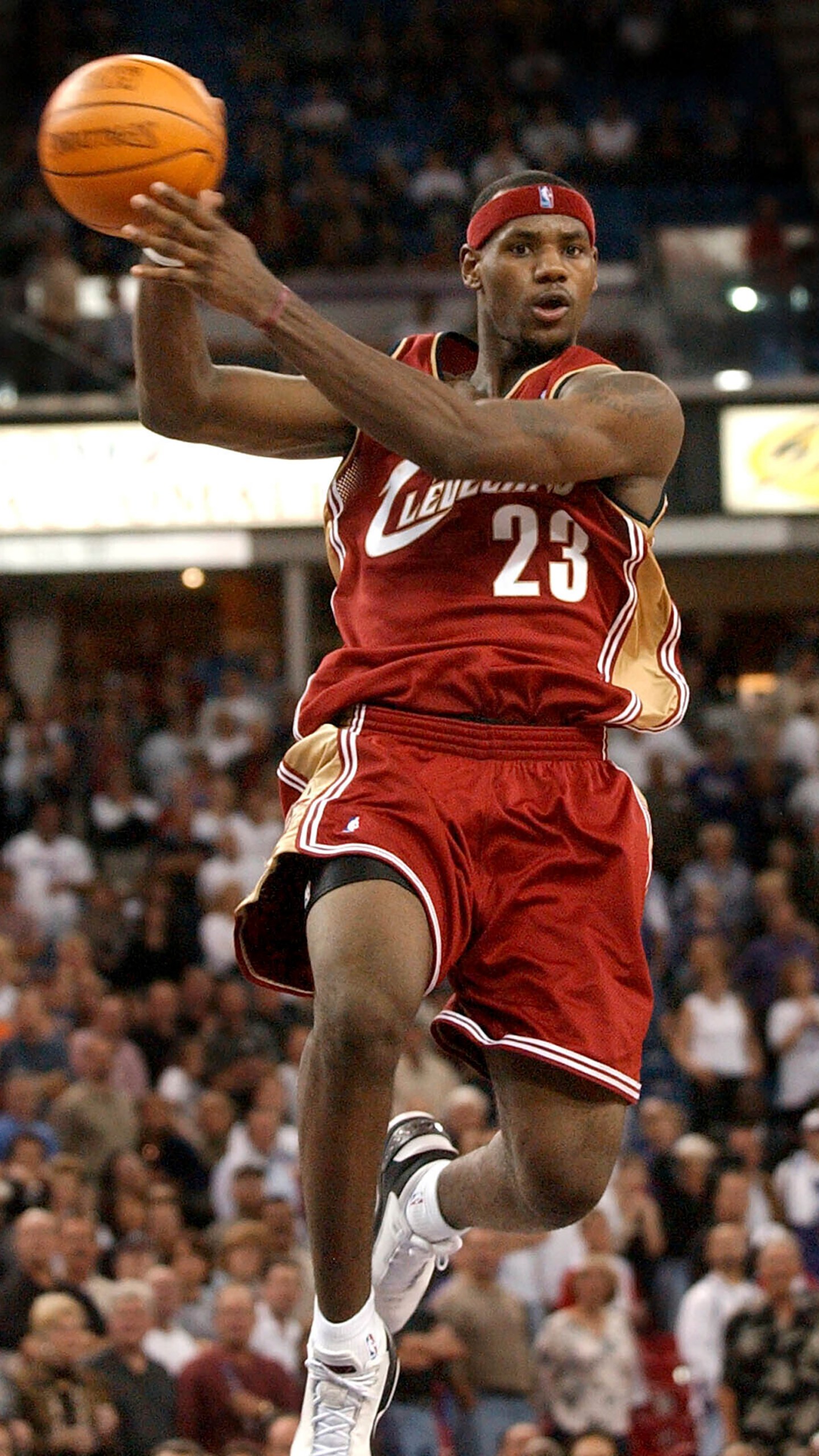 FILE - Cleveland Cavaliers guard LeBron James passes the ball off as he drives the lane against the Sacramento Kings during the second half at Arco Arena in Sacramento, Calif., on Oct. 29, 2003. (AP Photo/Steve Yeater, File)