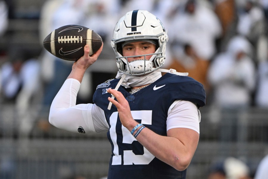 Penn State quarterback Drew Allar warms up for the game against SMU in the first round of the NCAA College Football Playoff, Saturday, Dec. 21, 2024, in State College, Pa. (AP Photo/Barry Reeger)