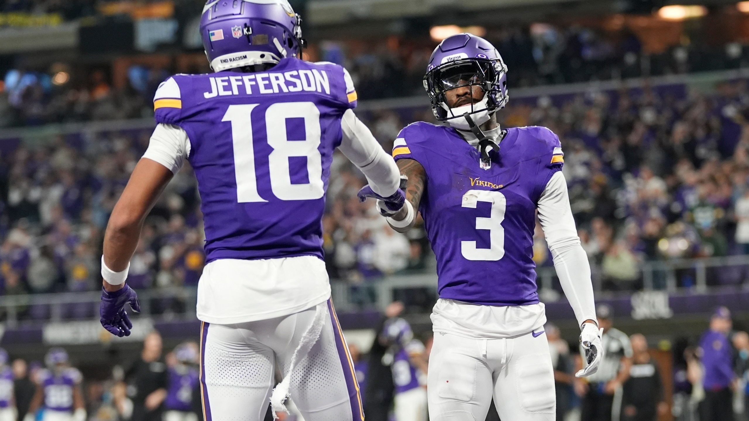 Minnesota Vikings' Jordan Addison celebrates his touchdown catch with Justin Jefferson during the second half of an NFL football game against the Green Bay Packers Sunday, Dec. 29, 2024, in Minneapolis. (AP Photo/Abbie Parr)