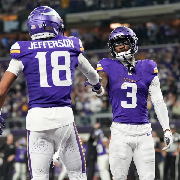 Minnesota Vikings' Jordan Addison celebrates his touchdown catch with Justin Jefferson during the second half of an NFL football game against the Green Bay Packers Sunday, Dec. 29, 2024, in Minneapolis. (AP Photo/Abbie Parr)