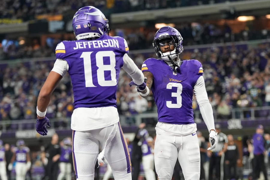 Minnesota Vikings' Jordan Addison celebrates his touchdown catch with Justin Jefferson during the second half of an NFL football game against the Green Bay Packers Sunday, Dec. 29, 2024, in Minneapolis. (AP Photo/Abbie Parr)