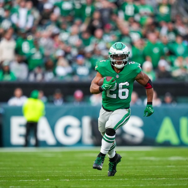 Philadelphia Eagles running back Saquon Barkley (26) runs the ball against the Dallas Cowboys during the second half of an NFL football game, Sunday, Dec. 29, 2024, in Philadelphia. (AP Photo/Matt Slocum)