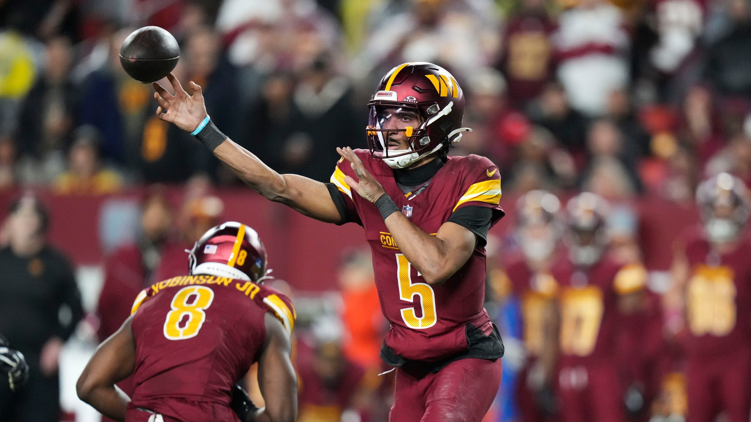 Washington Commanders quarterback Jayden Daniels (5) passes during the second half of an NFL football game, against the Atlanta Falcons Sunday, Dec. 29, 2024, in Landover, Md. (AP Photo/Stephanie Scarbrough)